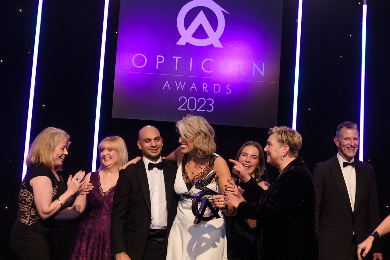The Park Vision team laughing as they celebrate being awarded with the Opticians Awards trophy