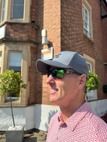 patient wearing sunglasses and cap